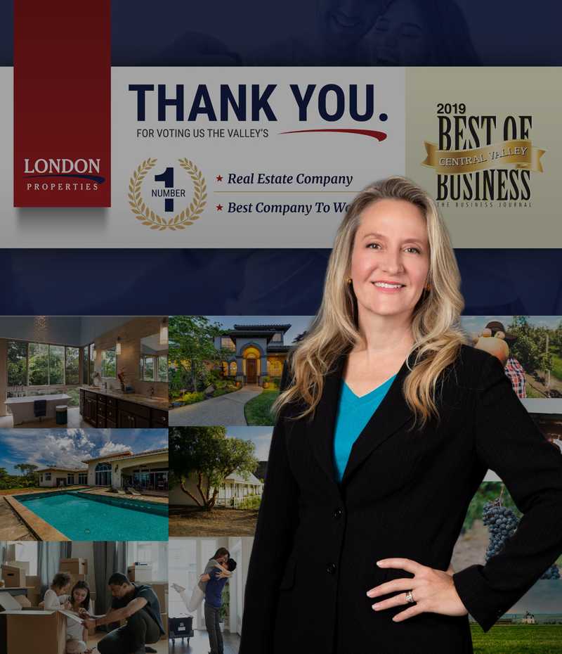 Kristi Adams stands in front of photos of satisfied clients.